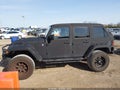 2013 Jeep Wrangler Unlimited — photo 6 of 16 | VIN 1C4HJWDG5DL680069