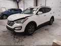 2016 Hyundai Santa Fe — photo 2 of 16 | VIN 5XYZU3LB6GG347511