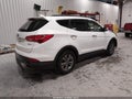 2016 Hyundai Santa Fe — photo 4 of 16 | VIN 5XYZU3LB6GG347511