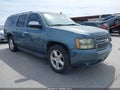 2010 Chevrolet Suburban 1500 — photo 1 of 16 | VIN 1GNUCHE04AR156210