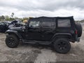 2014 Jeep Wrangler Unlimited — photo 14 of 16 | VIN 1C4BJWEG3EL198674