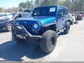 2010 Jeep Wrangler Unlimited — photo 2 of 16 | VIN 1J4BA5H15AL196477