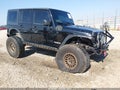2012 Jeep Wrangler Unlimited — photo 1 of 15 | VIN 1C4BJWDG7CL259443