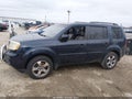 2012 Honda Pilot — photo 14 of 16 | VIN 5FNYF4H65CB018517