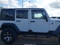 2011 Jeep Wrangler Unlimited — photo 13 of 16 | VIN 1J4BA6H10BL536027