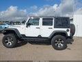 2011 Jeep Wrangler Unlimited — photo 14 of 16 | VIN 1J4BA6H10BL536027