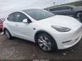 2023 Tesla Model Y — photo 1 of 18 | VIN 7SAYGAEE3PF861227