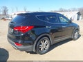 2013 Hyundai Santa Fe — photo 4 of 11 | VIN 5XYZU3LA5DG083989