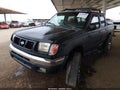 2000 Nissan Frontier — photo 2 of 11 | VIN 1N6ED27Y8YC427595