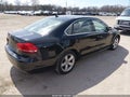 2013 Volkswagen Passat — photo 4 of 14 | VIN 1VWBP7A38DC016079