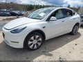2023 Tesla Model Y — photo 2 of 22 | VIN 7SAYGDEEXPA098525