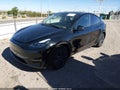 2024 Tesla Model Y — photo 2 of 15 | VIN 7SAYGAEE4RF183879