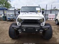 2014 Jeep Wrangler Unlimited — photo 12 of 16 | VIN 1C4BJWEG2EL209180