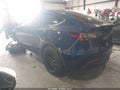 2023 Tesla Model Y — photo 3 of 15 | VIN 7SAYGAEE5PF853243