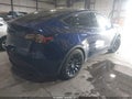 2023 Tesla Model Y — photo 4 of 15 | VIN 7SAYGAEE5PF853243