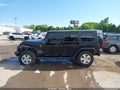 2010 Jeep Wrangler Unlimited — photo 14 of 16 | VIN 1J4BA5H12AL197988
