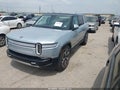 2024 Rivian R1S — photo 2 of 18 | VIN 7PDSGABA1RN033534