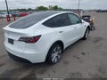 2022 Tesla Model Y — photo 4 of 17 | VIN 7SAYGDEE0NF315306