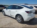 2023 Tesla Model Y — photo 3 of 19 | VIN 7SAYGDEE9PA038140