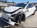 2022 Tesla Model Y — photo 2 of 17 | VIN 7SAYGDEF0NF345589