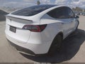 2022 Tesla Model Y — photo 4 of 17 | VIN 7SAYGDEF0NF345589
