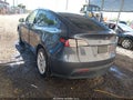 2023 Tesla Model Y — photo 3 of 22 | VIN 7SAYGDEE2PF629185