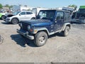 2000 Jeep Wrangler — photo 2 of 16 | VIN 1J4FA49SXYP774188