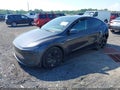 2026 Tesla Model Y — photo 2 of 16 | VIN 7SAYGDEE2TA411447