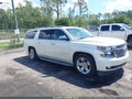 2015 Chevrolet Suburban 1500 — photo 1 of 16 | VIN 1GNSCKKCXFR151295
