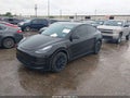 2024 Tesla Model Y — photo 2 of 21 | VIN 7SAYGDED7RF018529