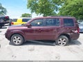2011 Honda Pilot — photo 14 of 16 | VIN 5FNYF4H68BB008899