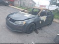 2014 Volkswagen Jetta — photo 2 of 10 | VIN 3VWD17AJ0EM226037