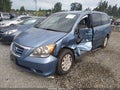 2010 Honda Odyssey — photo 2 of 18 | VIN 5FNRL3H23AB074263