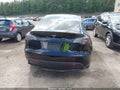 2023 Tesla Model Y — photo 16 of 19 | VIN 7SAYGAEE2PF766089