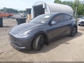2022 Tesla Model Y — photo 2 of 18 | VIN 7SAYGDEF9NF448235