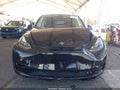 2025 Tesla Model Y — photo 11 of 15 | VIN 7SAYGAEE0SF249544