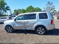 2014 Honda Pilot — photo 14 of 16 | VIN 5FNYF4H51EB015222