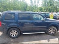 2009 Honda Pilot — photo 13 of 16 | VIN 5FNYF48979B023074