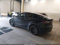 2023 Tesla Model Y — photo 3 of 15 | VIN 7SAYGDEEXPF885896
