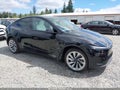 2026 Tesla Model Y — photo 1 of 20 | VIN 7SAYGDEE0TF560524