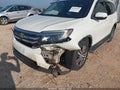 2018 Honda Pilot — photo 6 of 16 | VIN 5FNYF5H45JB026120