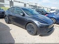 2026 Tesla Model Y — photo 1 of 18 | VIN 7SAYGDEE6TA634882