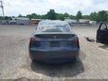 2024 Tesla Model Y — photo 15 of 17 | VIN 7SAYGDED6RF096669