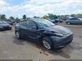 2024 Tesla Model Y — photo 1 of 17 | VIN 7SAYGDED6RF096669