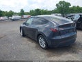 2024 Tesla Model Y — photo 3 of 17 | VIN 7SAYGDED6RF096669