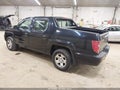 2009 Honda Ridgeline — photo 3 of 12 | VIN 5FPYK162X9B104187