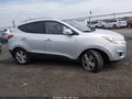 2011 Hyundai Tucson — photo 13 of 16 | VIN KM8JUCAC5BU186936