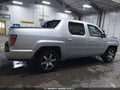 2014 Honda Ridgeline — photo 14 of 17 | VIN 5FPYK1F68EB007888