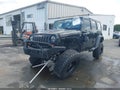 2011 Jeep Wrangler Unlimited — photo 2 of 17 | VIN 1J4HA6H11BL524477