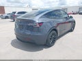 2023 Tesla Model Y — photo 4 of 18 | VIN 7SAYGDEE9PA121261